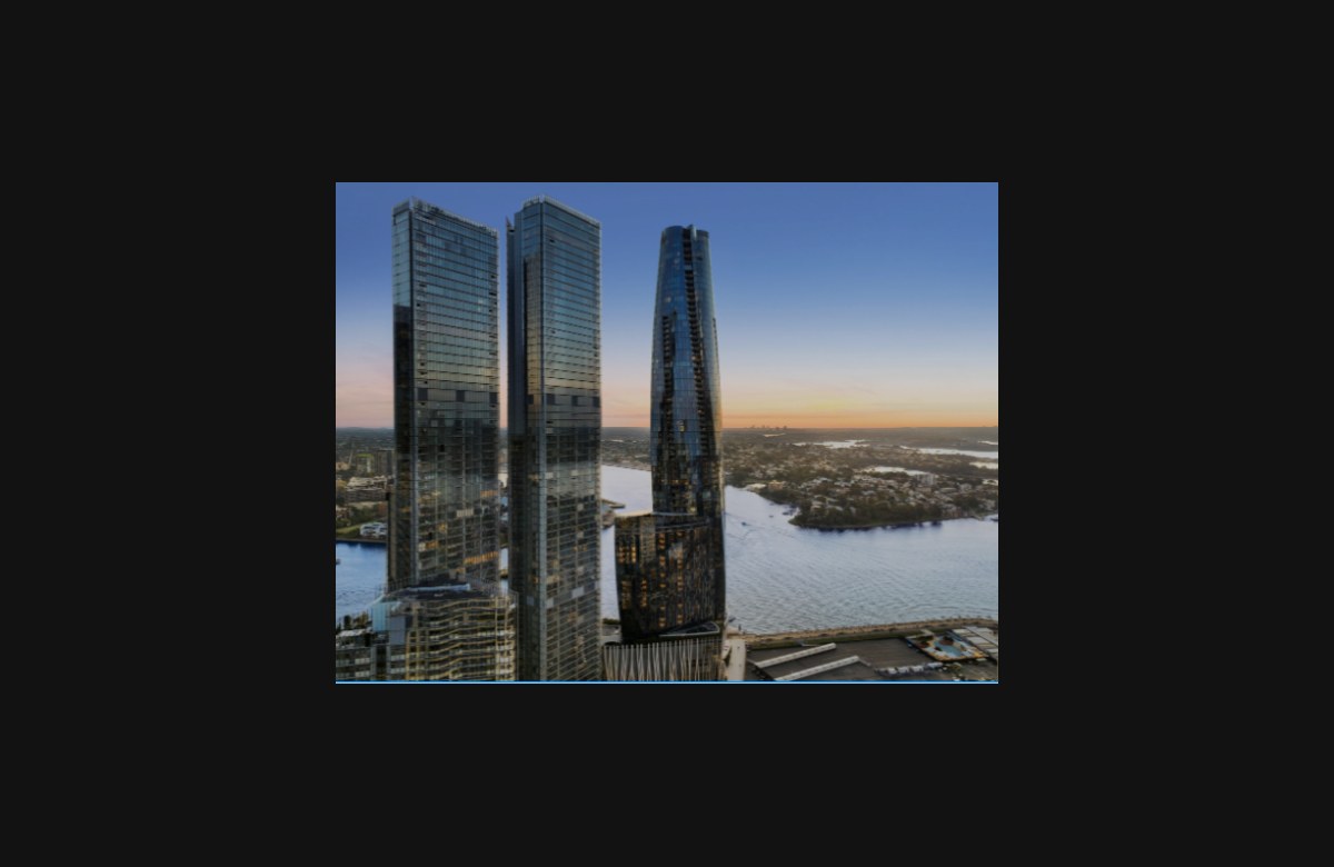 One Sydney Harbour towers above Sydney Harbour at dusk